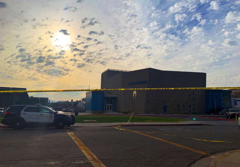 The sun begins to set over Saugus High School in Santa Clarita, Calif., late Thursday afternoon, Nov. 1, 2019, after a shooting incident there that morning. Authorities said a 16-year-old student shot five students, then himself. (AP Photo/Natalie Rice)