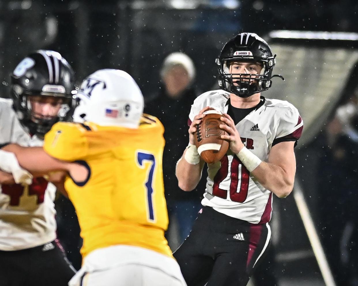 Badger’s JP Doyle (20) looks for a receiver against Kettle Moraine in a WIAA Division 2 Level 3 playoff game Friday, November 3, 2023, at Kettle Moraine High School in Wales, Wisconsin.