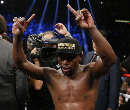 Floyd Mayweather Jr. celebrates after his welterweight title fight against Manny Pacquiao. (AP)