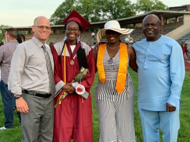 Verda Tetteh with her family and Principal Jeremy Roche.