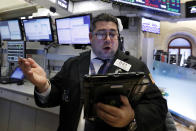 Trader Michael Capolino works on the floor of the New York Stock Exchange near the close of trading, Thursday, Dec. 27, 2018. U.S. stocks staged a furious late-afternoon rally Thursday, closing with gains after erasing a 600-point drop in the Dow Jones Industrial Average. (AP Photo/Richard Drew)