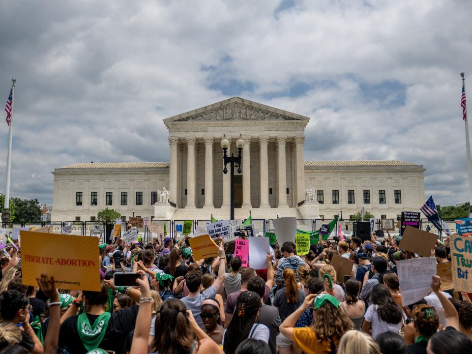 Pro-life and abortion-rights advocates crowd the Supreme Court building after Roe v. Wade was overturned Friday morning.