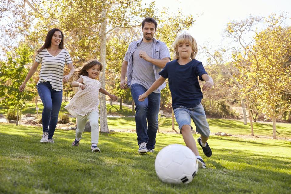Making exercise a family affair is a fun and easy way to get moving. <a href="https://www.shutterstock.com/image-photo/family-playing-soccer-park-together-610914800" rel="nofollow noopener" target="_blank" data-ylk="slk:Monkey Business Images/Shutterstock.com;elm:context_link;itc:0;sec:content-canvas" class="link ">Monkey Business Images/Shutterstock.com</a>
