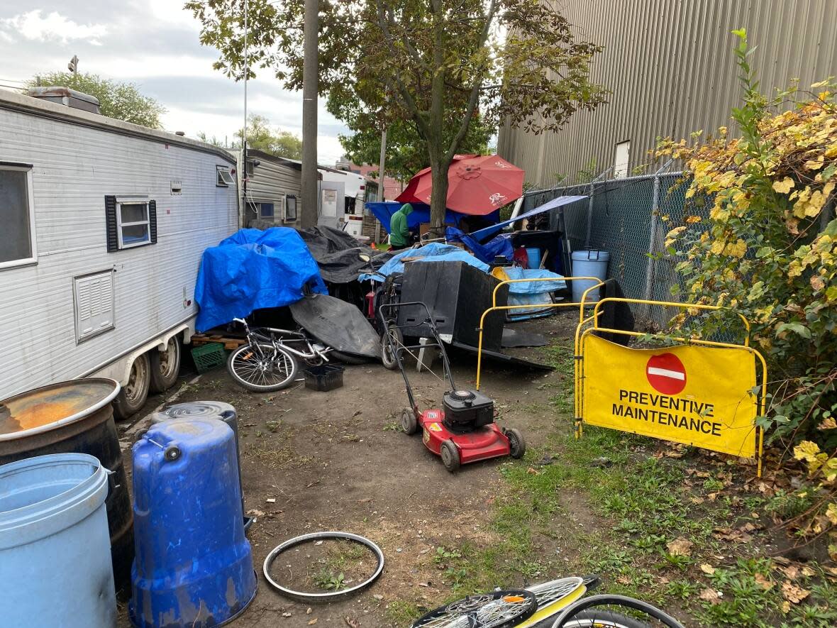 Police seized multiple bicycles and e-bikes from this trailer on Logan Avenue Wednesday afternoon. (Submitted by Brendan Dee - image credit)