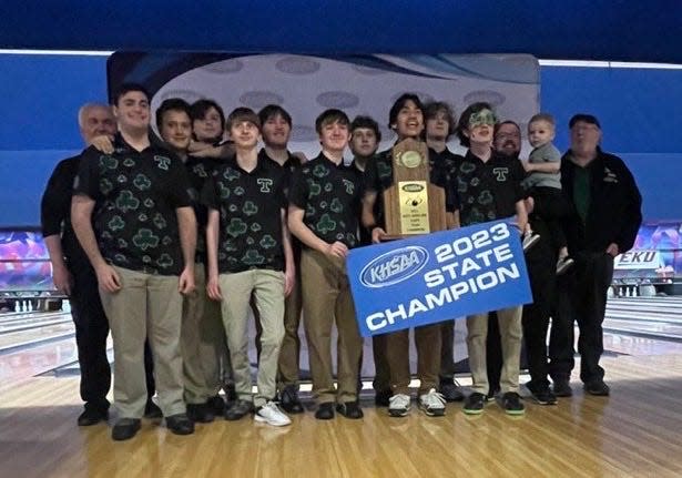 Members of the Trinity High School bowling team pose for a picture after winning the 2023 KHSAA boys bowling state championship at Kingpin Lanes in Jeffersontown on Feb. 7 2023