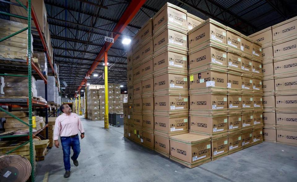 Manager Fernando Villacis walks through the Watsco Gemaire warehouse in Doral, on June 30, 2023. Al Diaz/adiaz@miamiherald.com