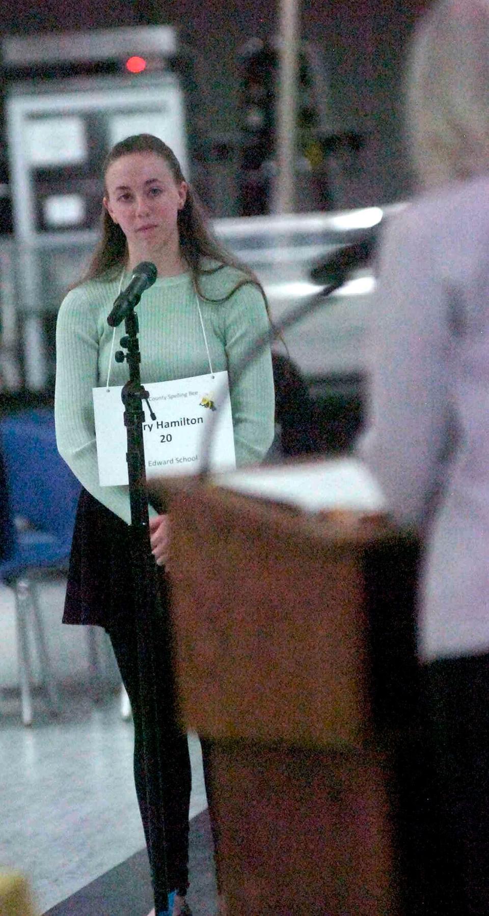 Champion Mary Hamilton of St. Edwards School listens to pronouncer Victoria Birk during the 49th annual Ashland County Spelling Bee held at the Ashland County-West Holmes Career Center on Tuesday.