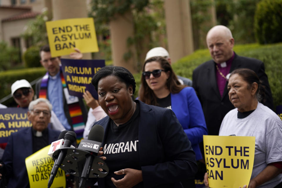 Guerline Jozef, Executive Director of the Haitian Bridge Alliance, speaks in front of demonstrators outside of the Richard H. Chambers U.S. Court of Appeals ahead of an asylum hearing, Tuesday, Nov. 7, 2023, in Pasadena, Calif. (AP Photo/Marcio Jose Sanchez)