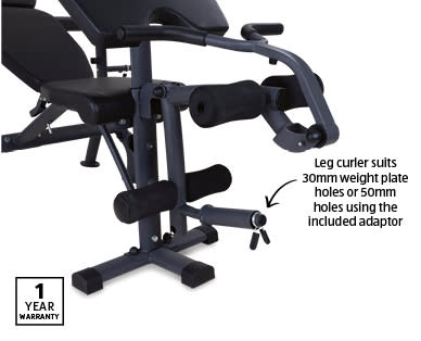 The multifunctional weight bench, featuring a leg curler with weight plate holes.