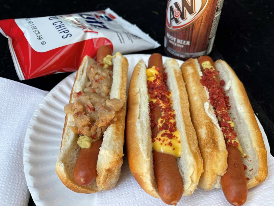 Hot dogs topped with (from left) potatoes and hot peppers, bacon and cheese, and bacon and mustard from Pattie's Franks, a hot dog truck in Brick.