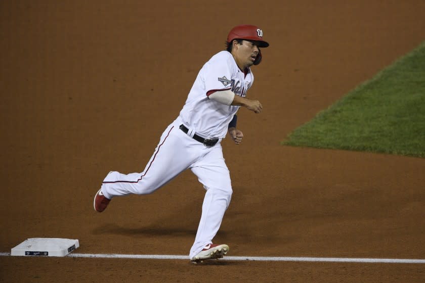 Washington Nationals' Kurt Suzuki runs towards home to score during a baseball game against the New York Mets, Thursday, Sept. 24, 2020, in Washington. (AP Photo/Nick Wass)