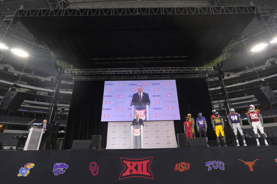 CORRECTS DATELINE TO ARLINGTON, TEXAS, NOT DALLAS AS ORIGINALLY SENT - Big 12 commissioner Bob Bowlsby, center, speaks during NCAA college football Big 12 media days Wednesday, July 14, 2021, in Arlington, Texas. (AP Photo/LM Otero)