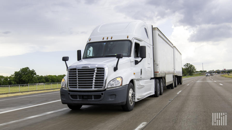 A white unidentified LTL rig on highway