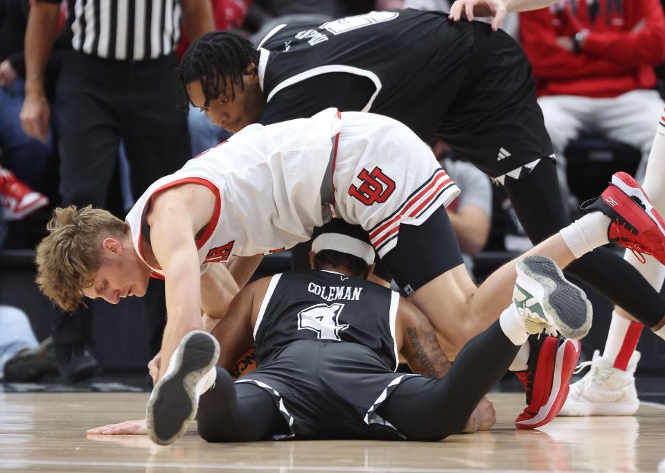 Utah Utes guard Cole Bajema (2) and Hawaii Warriors guard Noel Coleman (4) compete for the ball at the Delta Center in Salt Lake City on Thursday, Nov. 30, 2023. | Jeffrey D. Allred, Deseret News