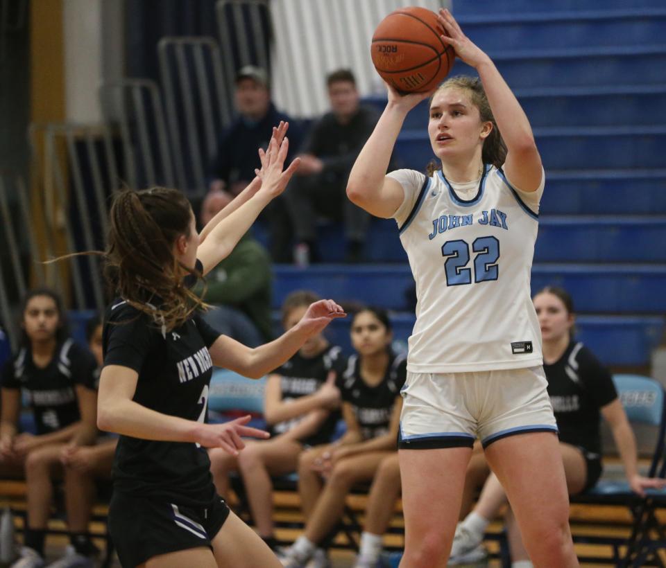 John Jay's Gabby Sweeney pulls up for a jumper against New Rochelle during a Section 1 Class AAA girls basketball quarterfinal on Feb. 23, 2024.