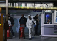 Turkish police crime scene investigators, looking for possible clues into the killing of Saudi journalist Jamal Khashoggi, work in an underground car park, where authorities Monday found a vehicle belonging to the Saudi consulate, in Istanbul, Tuesday, Oct. 23, 2018. Saudi officials murdered Khashoggi in their Istanbul consulate after plotting his death for days, Turkey's President Recep Tayyip Erdogan said Tuesday, contradicting Saudi Arabia's explanation that the writer was accidentally killed. (AP Photo/Emrah Gurel)