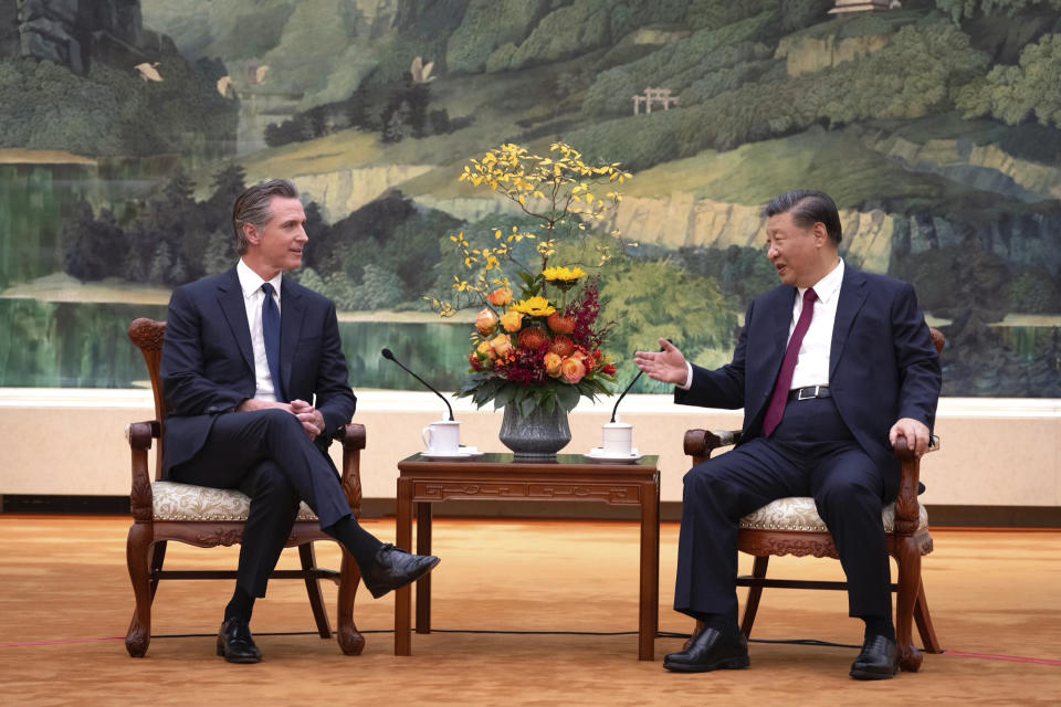 In this photo taken Wednesday, Oct 25, 2023, and released by Office of the Governor of California , California Gov. Gavin Newsom, left, meets with Chinese President Xi Jinping at the Great Hall of the People in Beijing. (Office of the Governor of California via AP)