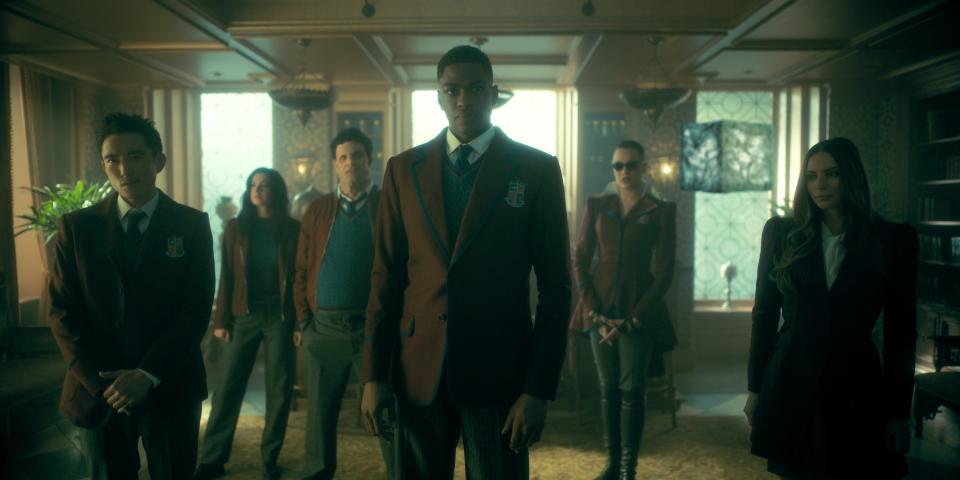 From left: Justin H. Min as Ben Hargreeves, Cazzie David as Jayme, Jake Epstein as Alphonso, Justin Cornwell as Marcus, Britne Oldford as Fei, and Genesis Rodriguez as Sloane in season three, episode one of "The Umbrella Academy."