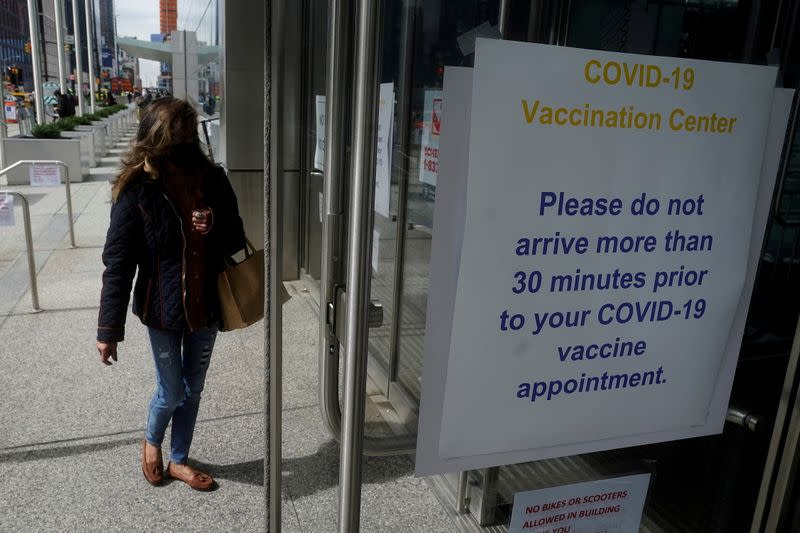 People arrive at the Javits Center mass vaccination location in New York