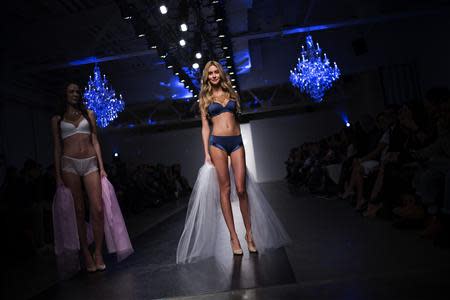 A model presents a creation from the GS Shop Lingerie Show featuring Wonderbra, Anna Sui and Spanx Fall 2014 collections during New York Fashion Week February 4, 2014. REUTERS/Eric Thayer