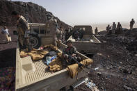 Yemeni fighters backed by the Saudi-led coalition gather on the Kassara frontline near Marib, Yemen, Sunday, June 20, 2021. (AP Photo/Nariman El-Mofty)