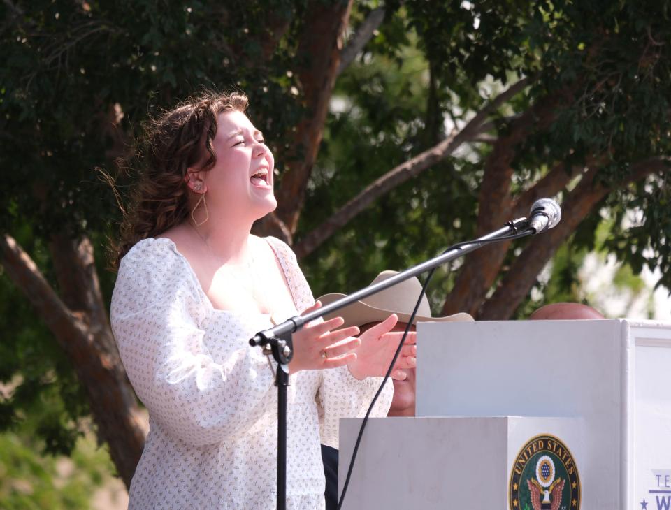 Matilyn Myrick sings "It Is Well With My Soul" at a boat dedication ceremony for her father, late Trooper Matthew Myrick, Friday morning at the Texas Panhandle War Memorial Center in Amarillo.