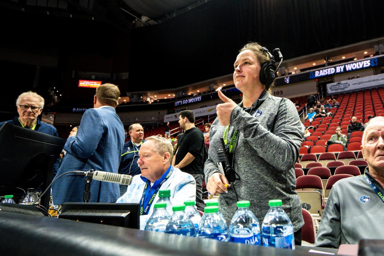 Randi Burrell, Iowa Wolves vice president of operations, gives a thumbs up to an official before Wednesday's game at Wells Fargo Arena in Des Moines.