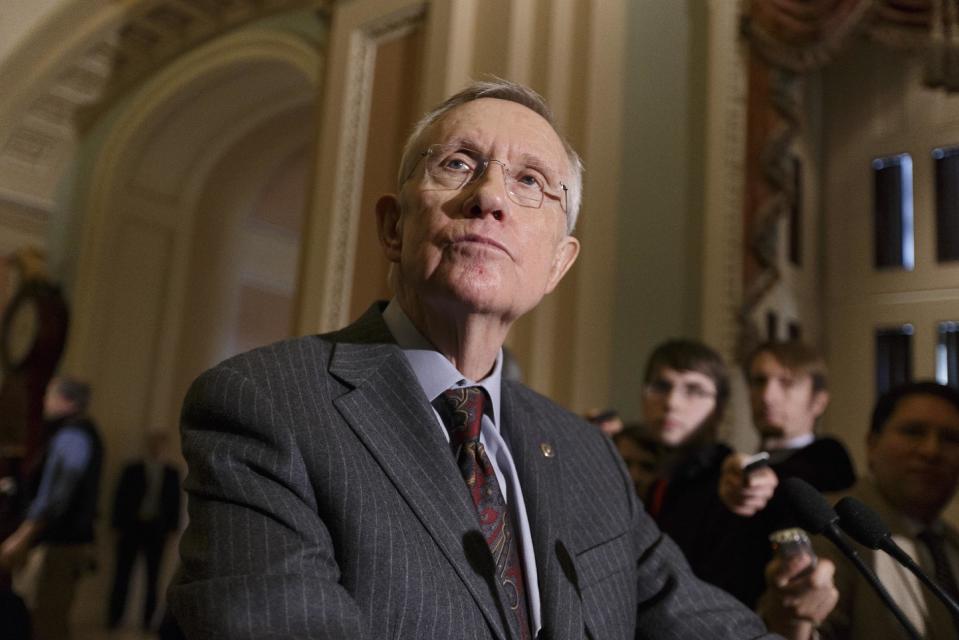 In this Jan. 7, 2014, photo, Senate Majority Leader Harry Reid tells reporters that he was pleased that six Republicans voted with the Democratic majority to proceed with legislation to renew jobless benefits for the long-term unemployed, at the Capitol in Washington. The struggle in Washington over whether or not to renew expired jobless benefits for the long-term unemployed is as much about providing aid to 1.3 million out-of-work Americans as it is about drawing the first political bright line of an election year that has the economy as one of its central themes. (AP Photo/J. Scott Applewhite)