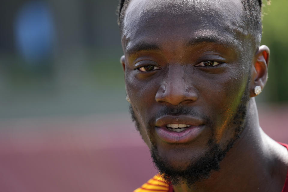 Roma's Tammy Abraham talks with journalists after training during a media day ahead of the Europa League soccer final, at the Trigoria training centre, in Rome, Thursday, May 25, 2023. Roma will play an Europa League final against Sevilla in Budapest, Hungary, next Wednesday, May 31. (AP Photo/Andrew Medichini)