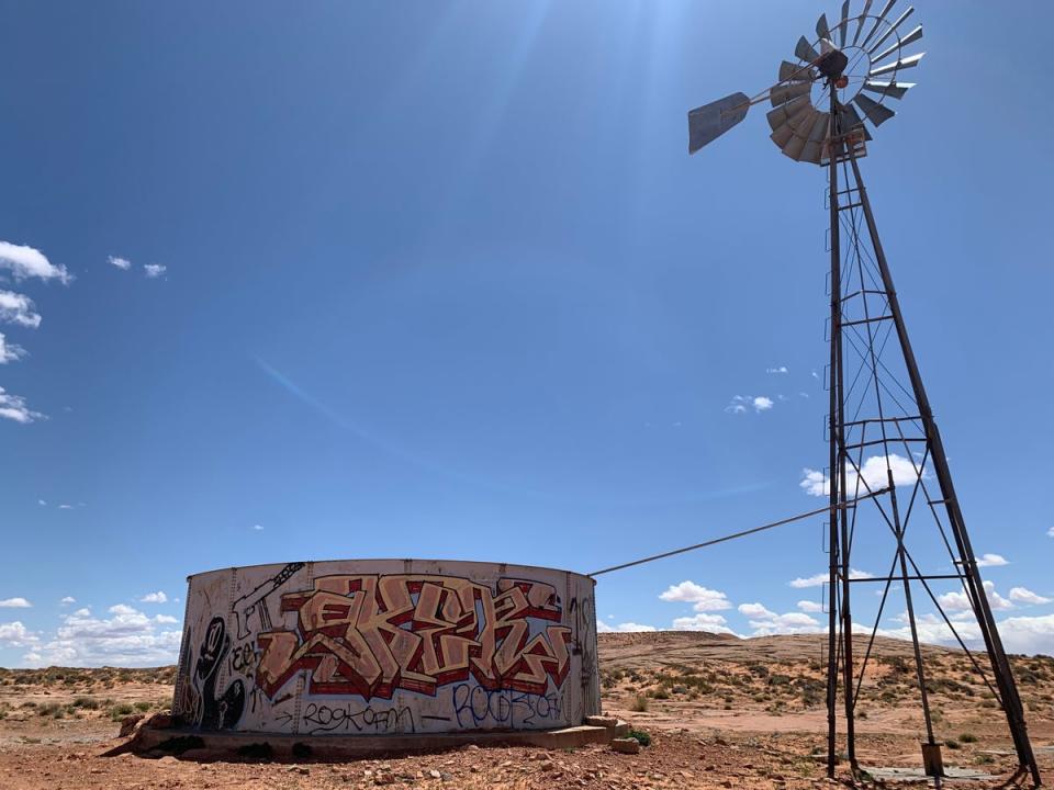 A water tank and windmill, suggested by a medicine man to be the potential site of remains, is seen on the Navajo Nation on April 23rd, 2022. (Justin Higginbottom)