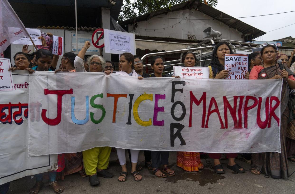 Activists protesting ethnic violence in northeastern Manipur state shout slogans in Mumbai, India, on July 24, 2023. Violence between tribal communities in the state has flared up in recent months. (AP Photo/Rafiq Maqbool)