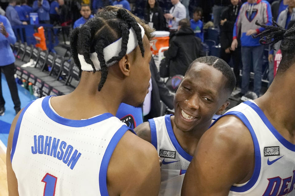 DePaul's Javan Johnson (1) and Umoja Gibson celebrate the team's 73-72 upset of No. 8 Xavier in an NCAA college basketball game Wednesday, Jan. 18, 2023, in Chicago. (AP Photo/Charles Rex Arbogast)