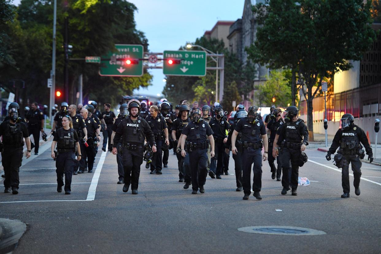 JSO officers in riot gear.