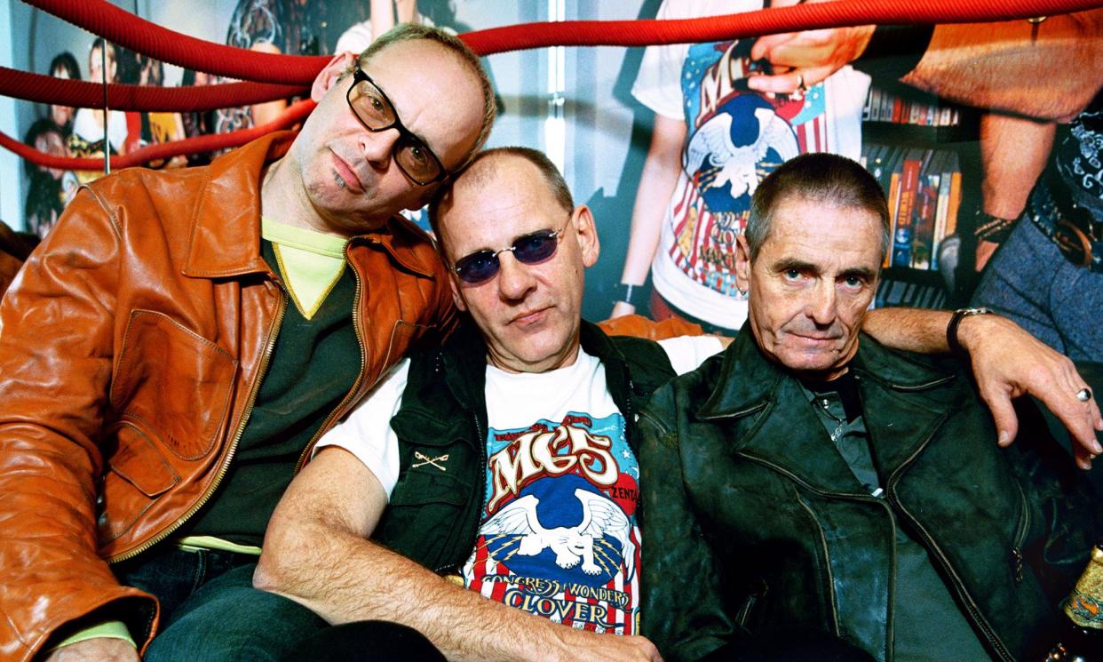 <span>Dennis Thompson, centre, the drummer for MC5, has died age 75. He is pictured with guitarist Wayne Kramer and bassist Michael Davis in London in 2003.</span><span>Photograph: Linda Nylind/The Guardian</span>