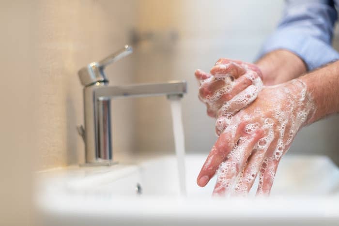 a person washing their hands