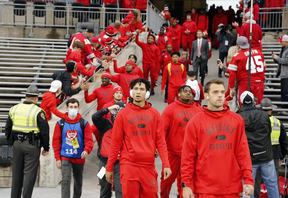 Ohio State Buckeyes quarterback C.J. Stroud (7) enters the field as the football team arrives at Ohio Stadium before their game against Penn State on October 30, 2021. 