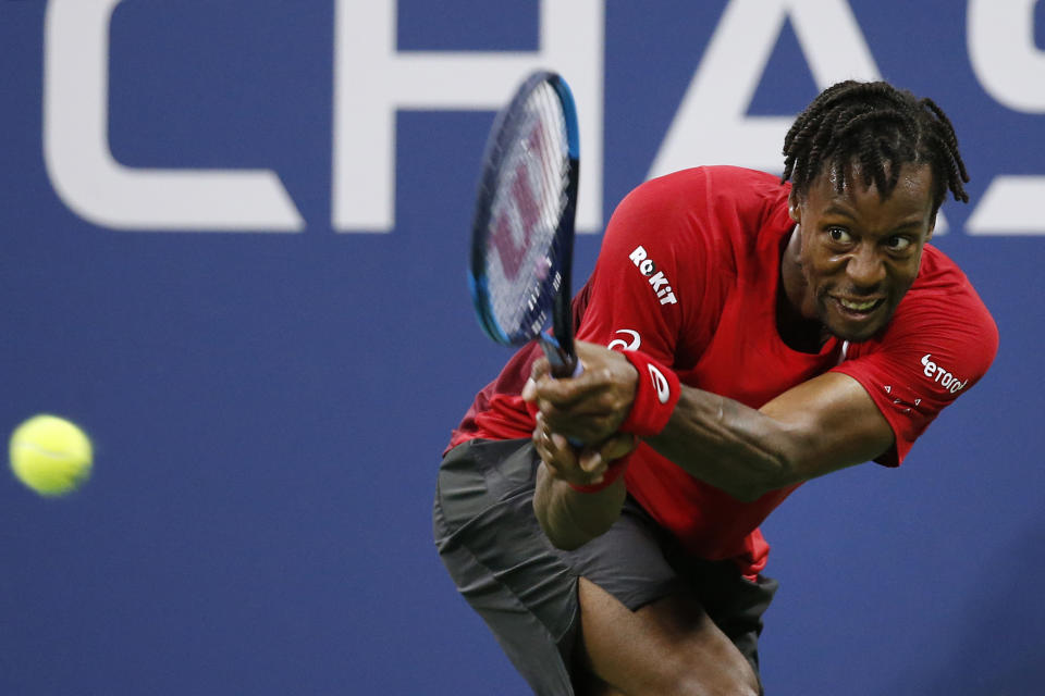 Gael Monfils, of France, returns a shot to Denis Shapovalov, of Canada, during the third round of the U.S. Open tennis tournament Saturday, Aug. 31, 2019, in New York. (AP Photo/Jason DeCrow)