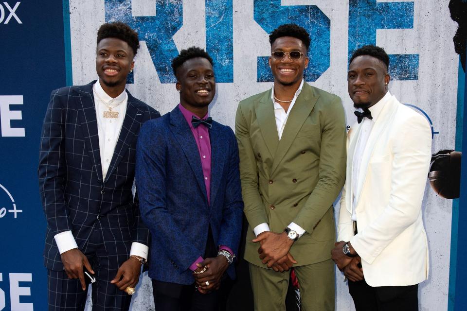 Giannis Antetokounmpo (second from right) with brothers (L-R) Kostas, Alex and Thanasis attend "Rise" premiere in June. Alex is the only one of the brothers to not play in the NBA.