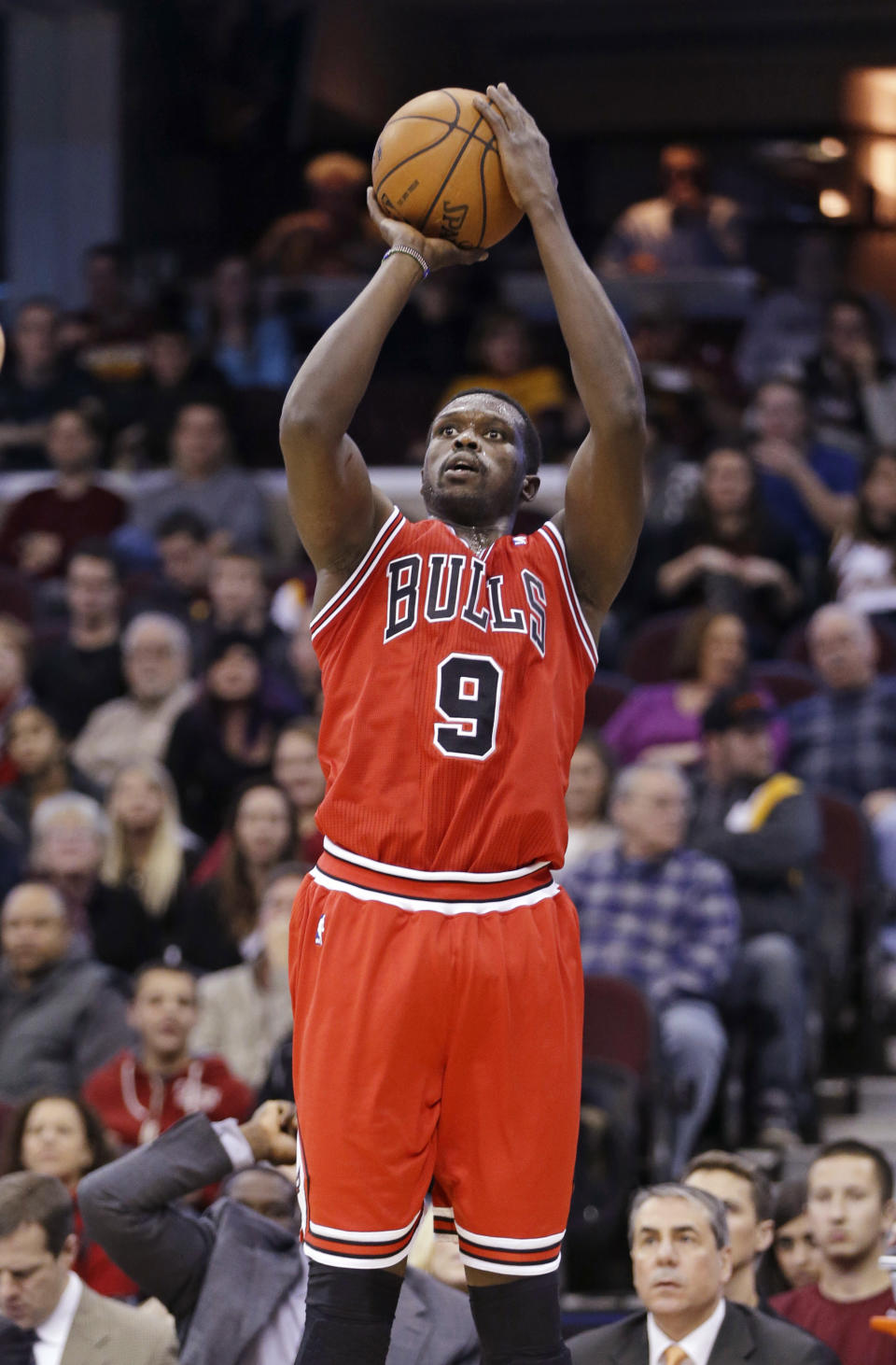 In this Nov. 30, 2013 photo, Chicago Bulls' Luol Deng, from Sudan, shoots against the Cleveland Cavaliers in an NBA basketball game in Cleveland. The Cavaliers acquired Deng, a two-time All-Star small forward, from the Chicago Bulls early Tuesday, Jan. 7, 2014, for center Andrew Bynum and future draft choices. (AP Photo/Mark Duncan)