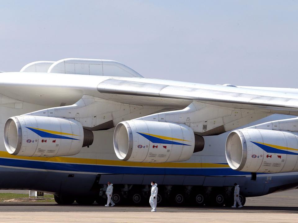 This picture shows the wing and three of the six turbofans of the Ukrainian Antonov An-225 Mriya coming from China to deliver 8,6 million face masks and 150 tons of sanitary equipment ordered by a private customer, at the Paris-Vatry airport in Bussy Lettree, on April 19, 2020, on the 34th day of a strict lockdown in France to stop the spread of COVID-19 (novel coronavirus). - The Antonov-225 is a cargo plane designed as part of the former Soviet Union's space programme. The only copy in use can carry up to 250 tonnes up to 4,000 km.