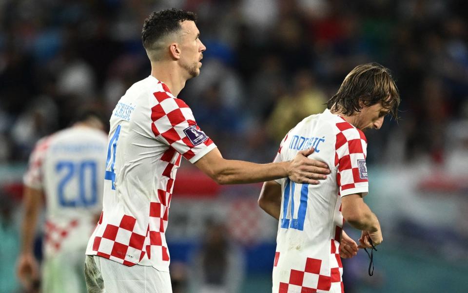 Croatia's Luka Modric alongside teammate Ivan Perisic as he is substituted off - REUTERS