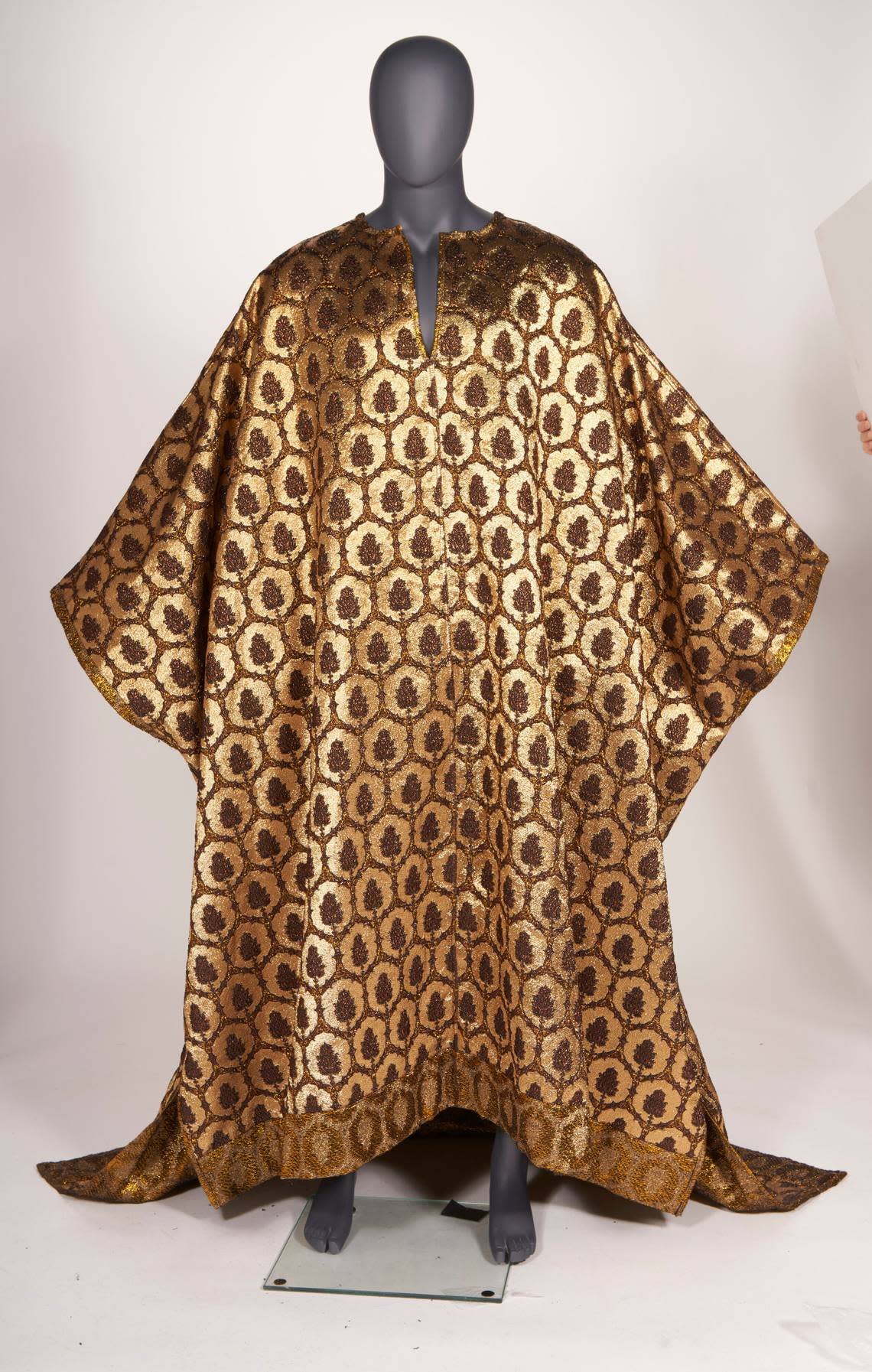 A gold caftan that was owned by André Leon Talley that will be sold in an auction. Made by Dapper Dan, circa 2007, Talley wore it to a Carolina Herrera New York Fashion Week show.