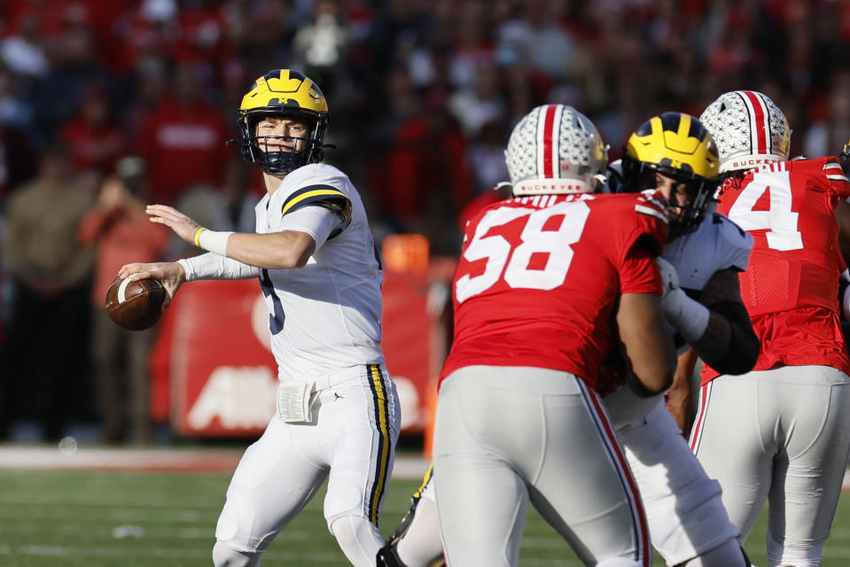 Michigan quarterback J.J. McCarthy drops back top pass against Ohio State during the second half of an NCAA college football game on Saturday, Nov. 26, 2022, in Columbus, Ohio. (AP Photo/Jay LaPrete)
