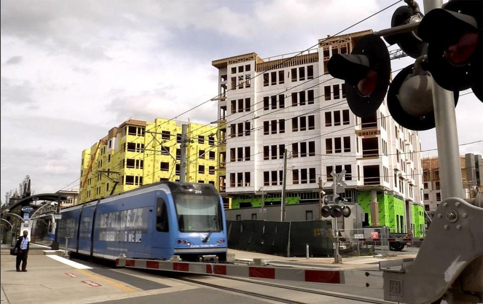 A light rail train passes through New Bern St. at Rail Crossing Lane on Wednesday, March 28, 2018. Higher end apartments are springing up in the South End area. The Charlotte City Council and local leaders talked about the importance of encouraging developers to build affordable housing on the Blue Line since before the first tracks were laid. The reason was to ensure it benefits everyone not just the affluent. Only a handful of income-restricted units have been built, one project hit enormous cost overruns and one was a boondoggle that has seen nothing built but $500,000 townhouses. Instead, the Blue Line and the extension have become a haven for well-heeled young professionals, with some of the highest rents in Charlotte.