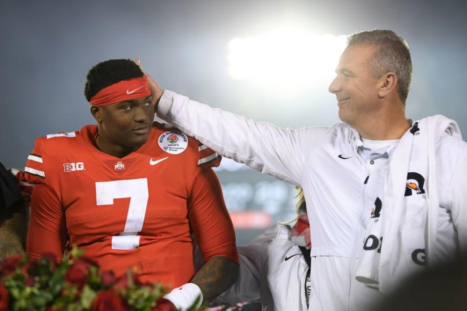 PASADENA, CA - JANUARY 01:  Dwayne Haskins #7 of the Ohio State Buckeyes and Ohio State Buckeyes head coach Urban Meyer celebrate after winning the Rose Bowl Game presented by Northwestern Mutual at the Rose Bowl on January 1, 2019 in Pasadena, California.  (Photo by Harry How/Getty Images)
