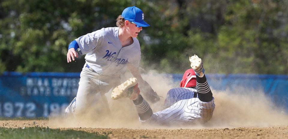 Brockton's Armani LoRusso slides successfully into second base on a steal attempt ahead of the Braintree fielder's tag during a game on Friday, May 13, 2022.