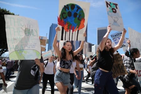 Students attend a protest rally to call for urgent action to slow the pace of climate change, in Los Angeles