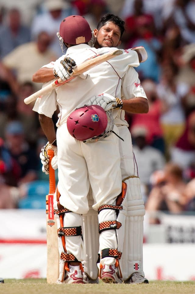 Ramnaresh Sarwan, right, and Shivnarine Chanderpaul embrace