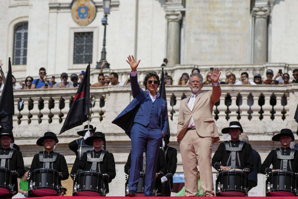 Actor Tom Cruise, left and director Chris McQuarrie pose for photographers on the red carpet of the world premiere for the movie "Mission: Impossible - Dead Reckoning" at the Spanish Steps in Rome Monday, June 19, 2023. (AP Photo/Alessandra Tarantino)