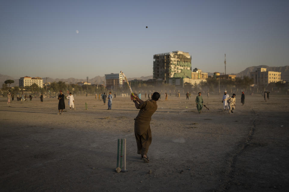 Afghans play cricket at the Chaman-e-Hozari Park in Kabul, Afghanistan, Friday, Sept. 17, 2021. (AP Photo/Bernat Armangue)